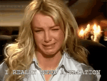 a woman is crying with the words i really need a vacation behind her