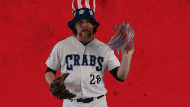 a baseball player for the crabs is holding a glove and a pom pom