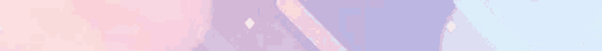 a close up of a pink , purple , and blue iridescent foil .