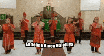 a group of people are dancing in front of a church with the words " endehon amen haleluya " written above them