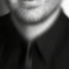 a black and white photo of a man 's face with a tie .
