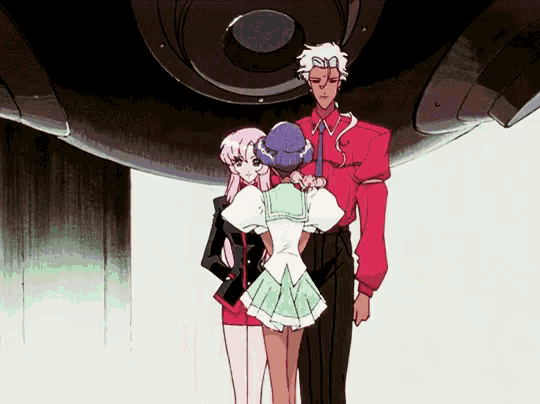 a man in a red shirt stands next to two girls