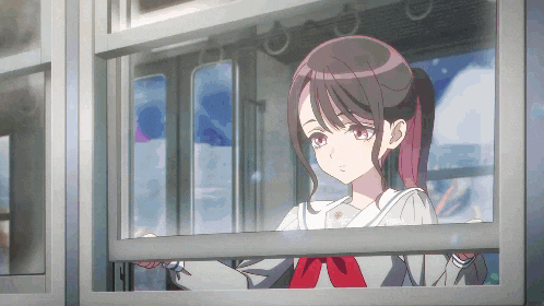 a girl in a school uniform looks out of a train window