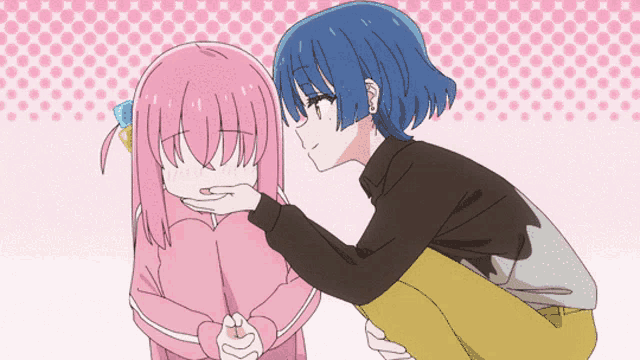 a girl with blue hair is touching a girl with pink hair