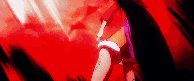 a person is holding a knife in their hand in a dark room .