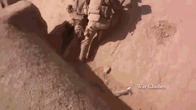 an aerial view of a group of soldiers in the desert with the words war clashes below them