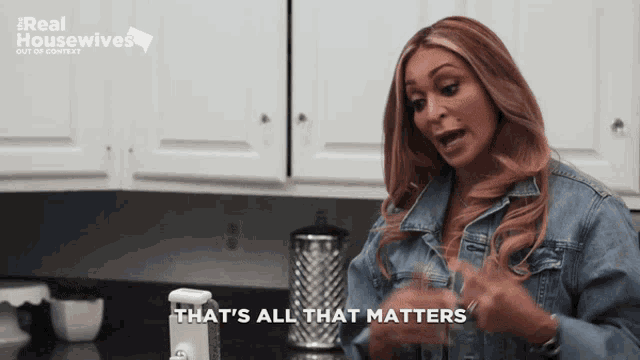 a woman says that 's all that matters in front of a real housewives logo