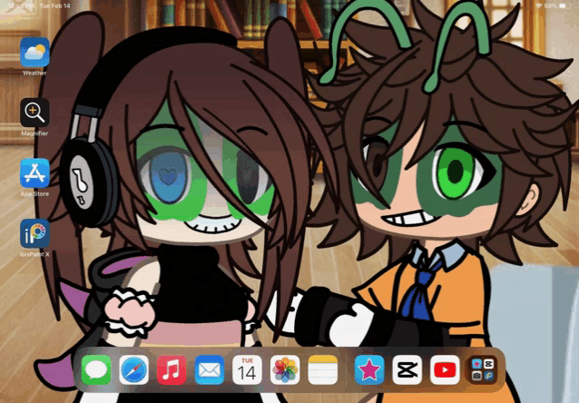 a phone screen shows a couple of cartoon characters and the date of tuesday february 14