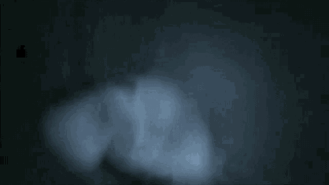 a close up of a person 's face with smoke coming out of it