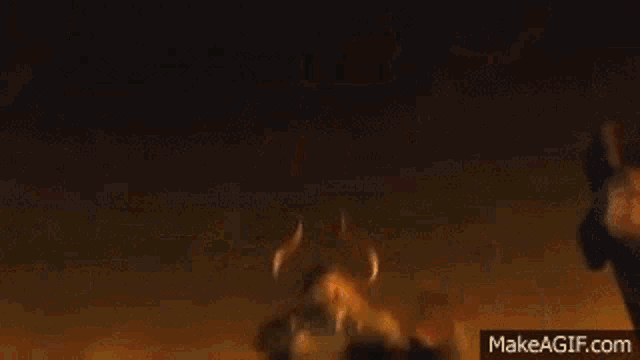 a cartoon viking with a beard and horns is holding an axe and screaming .