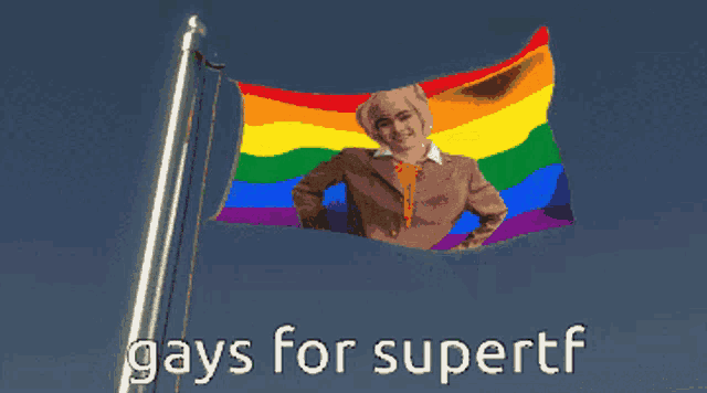 a rainbow flag with a picture of a man on it and the words gays for supertf