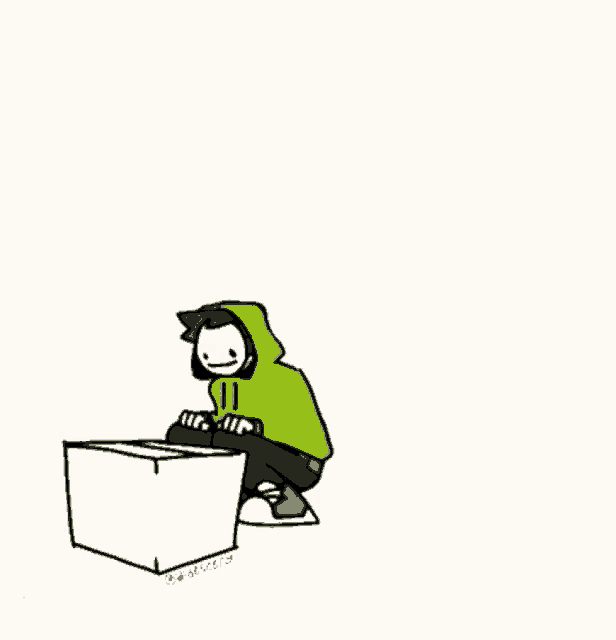 a man in a green hoodie is standing on top of a cardboard box .
