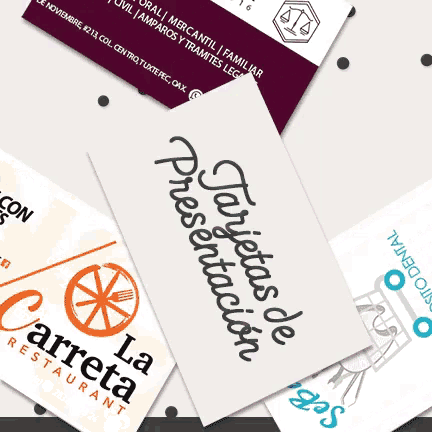 several business cards are stacked on top of each other