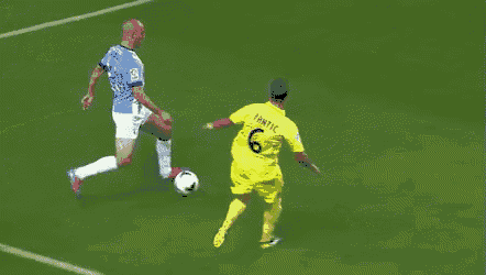 a soccer player in a yellow jersey with the number 3 on it