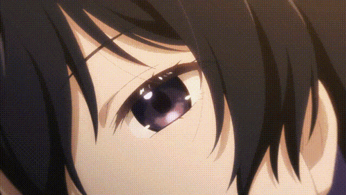 a close up of a person 's eyes with a purple pupil