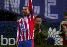 a soccer player in a red and white striped jersey with the number 2 on it