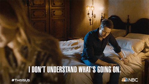 a man is sitting on a bed with the words " i don t understand what 's going on "