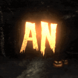 a sign that says an is lit up in a dark room