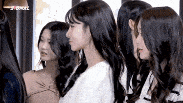 a group of girls are standing next to each other and the word signal is on the bottom right