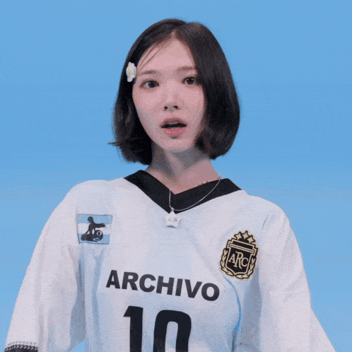 a girl wearing a archivo jersey with the number 10