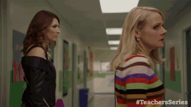 two women standing next to each other in a hallway with #teachersseries on the bottom