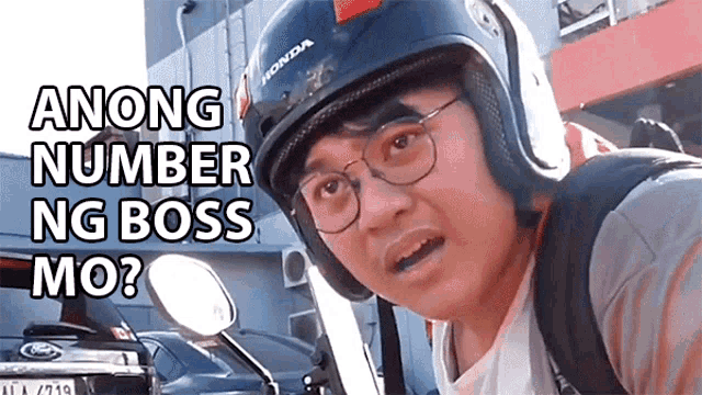 a man wearing a helmet and glasses says among number ng boss mo