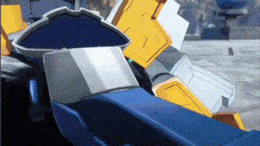 a blue and yellow robot with the number 7 on the back of it