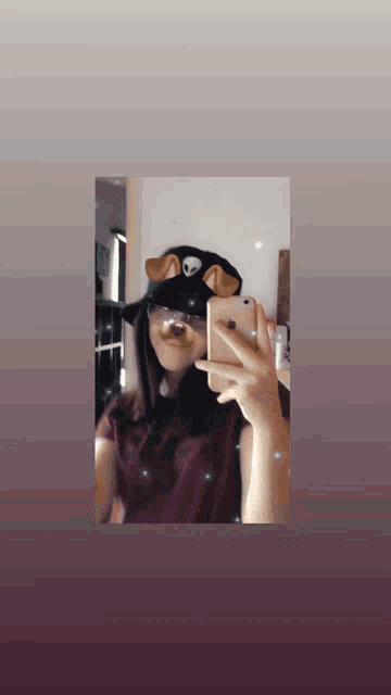 a girl is taking a picture of herself in the mirror