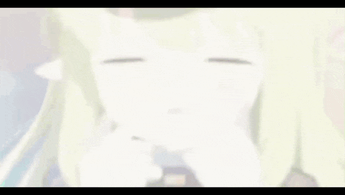 a close up of a girl with green hair and white ears making a funny face .