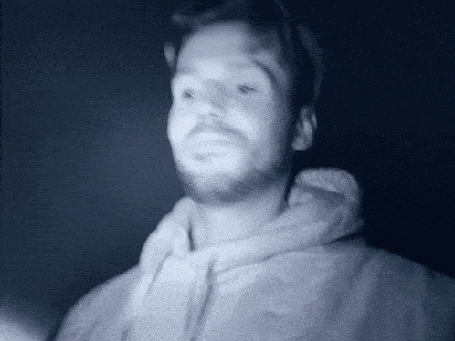 a blurry picture of a man with a beard