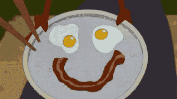 a cartoon drawing of eggs and bacon with a smiley face