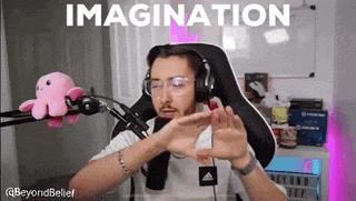 a man wearing headphones and glasses is sitting in front of a microphone and making a funny face .