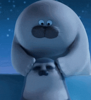 a stuffed animal with big eyes and a huge nose