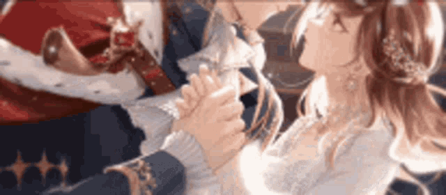 a man is holding a woman 's hand while they are dancing .