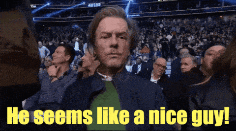 a man sitting in a crowd with the words he seems like a nice guy below him