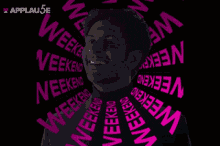 a man 's face is surrounded by pink weekend words
