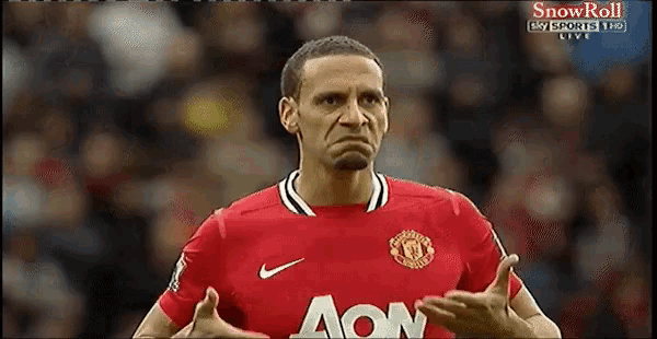 a soccer player wearing a red jersey with aon on it