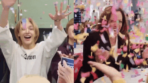 a man and a woman are celebrating with confetti falling from the sky .