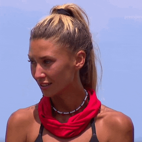 a woman with a red scarf around her neck