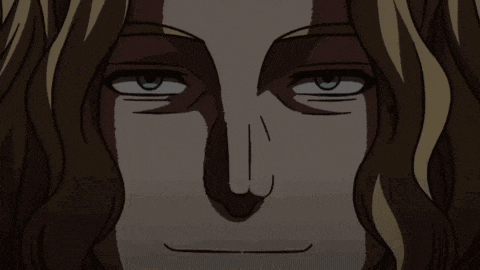 a close up of a man 's face with a slight smile