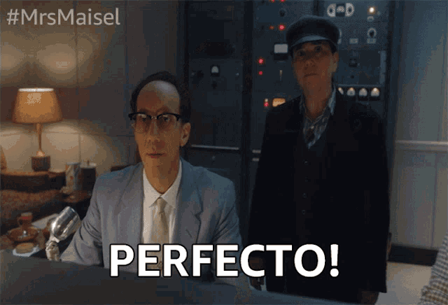 a man in a suit and tie says perfecto in front of a man in a hat