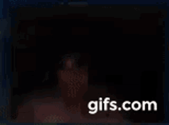a picture of a man is displayed on a screen with the website gifs.com at the bottom