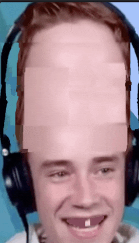 a man wearing headphones has a missing teeth