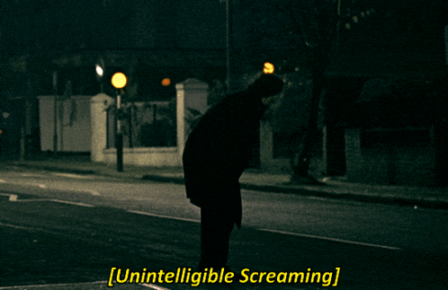 a person is kneeling down on the side of the road with the words unintelligible screaming above them