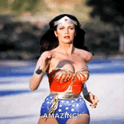 a woman in a wonder woman costume is running across a road .