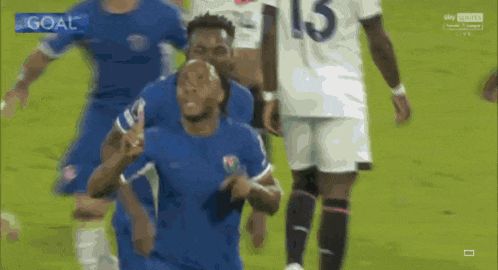 a soccer player in a blue jersey with the number 15 on it
