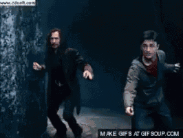 harry potter is wearing glasses and a hoodie in a gif .