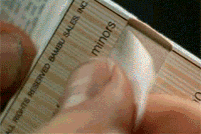 a person is holding a piece of paper that says " all profits reserved bambu sales inc minors "