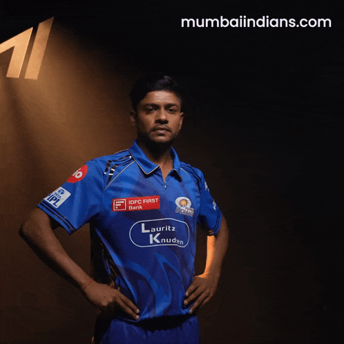 a man wearing a blue shirt that says lauriz knudsen on it