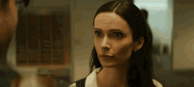 a close up of a woman looking at a man